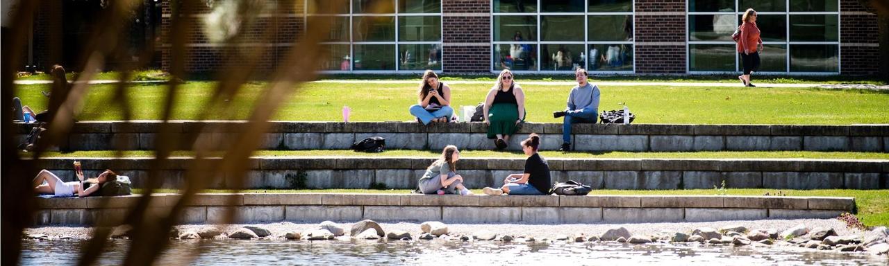 students by Zumberge Pond